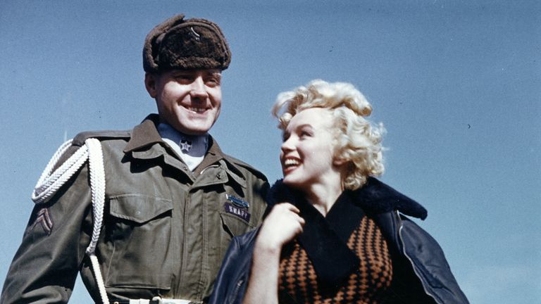 Marilyn Monroe poses with an American soldier