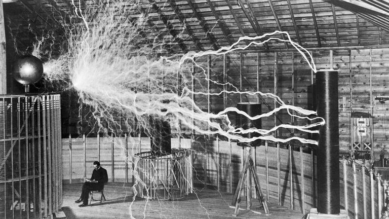Nikola Tesla with his equipment