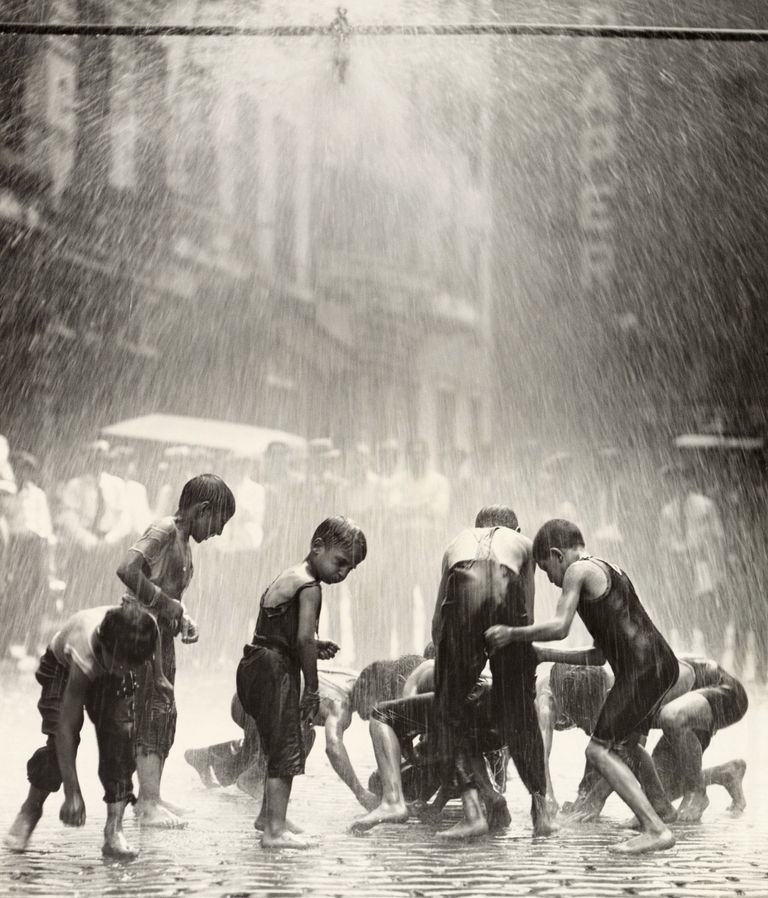 https://www.gettyimages.co.uk/detail/news-photo/children-under-sprinkling-pipe-on-jacob-street-new-york-are-news-photo/517422672 children