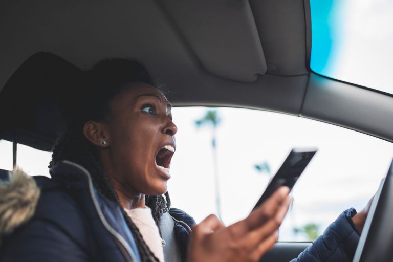 https://www.gettyimages.co.uk/detail/photo/shocked-driver-woman-scrolling-using-a-smartphone-royalty-free-image/1217093785