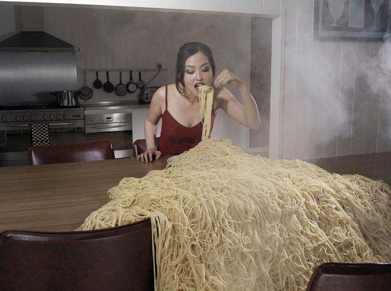 https://www.gettyimages.co.uk/detail/photo/woman-standing-at-table-eating-heap-of-spaghetti-royalty-free-image/sb10064661a-001?phrase=strange%20stock&adppopup=true