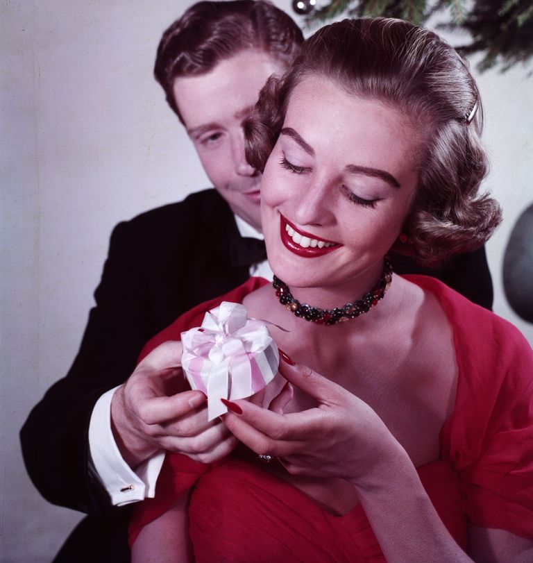 https://www.gettyimages.com/detail/news-photo/lovers-exchange-gifts-beneath-a-decorated-christmas-tree-news-photo/3066533?phrase=couple%20in%20love