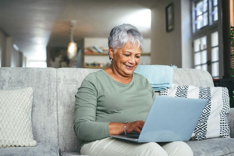 https://www.gettyimages.co.uk/detail/photo/shot-of-a-senior-woman-using-a-laptop-on-the-sofa-royalty-free-image/1357522206 senior woman laptop