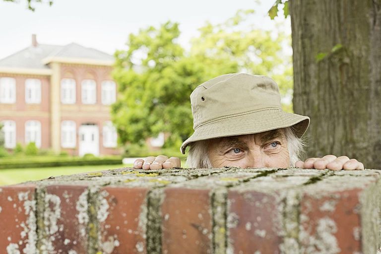 https://www.gettyimages.co.uk/detail/photo/senior-man-wearing-hat-peering-over-garden-wall-royalty-free-image/475152335?phrase=old%20man%20neighbor&adppopup=true
