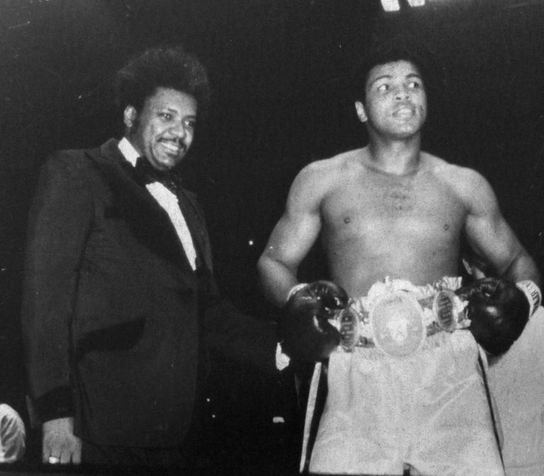 https://www.gettyimages.co.uk/detail/news-photo/muhammad-ali-wears-his-belts-in-the-ring-after-winning-the-news-photo/157078641 Muhammad Ali Don King