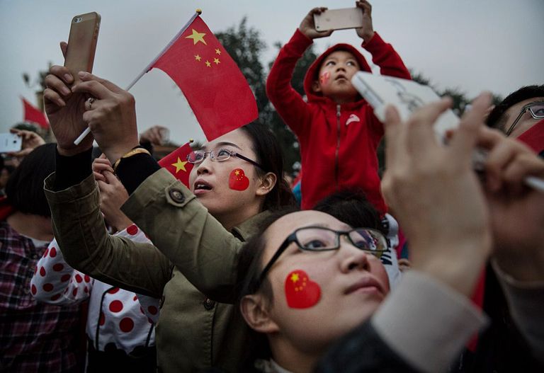 https://www.gettyimages.com/detail/news-photo/chinese-tourists-take-pictures-near-tiananmen-square-on-the-news-photo/456465568?adppopup=true