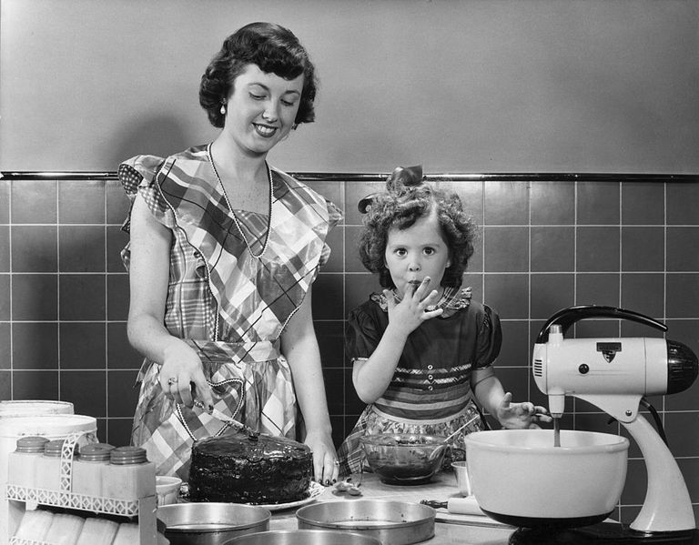 https://www.gettyimages.co.uk/detail/news-photo/young-girl-licks-frosting-from-a-bowl-as-she-helps-her-news-photo/3207450