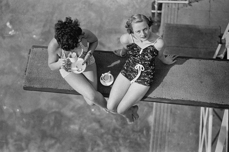 https://www.gettyimages.co.uk/detail/news-photo/two-women-having-tea-on-the-diving-board-at-finchley-news-photo/3312814