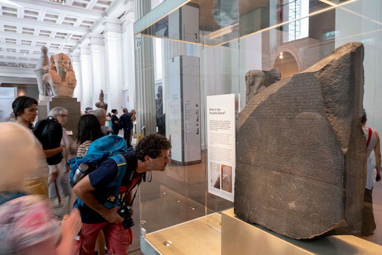 https://www.gettyimages.co.uk/detail/news-photo/visitors-looking-at-the-rosetta-stone-at-the-british-museum-news-photo/1242709868