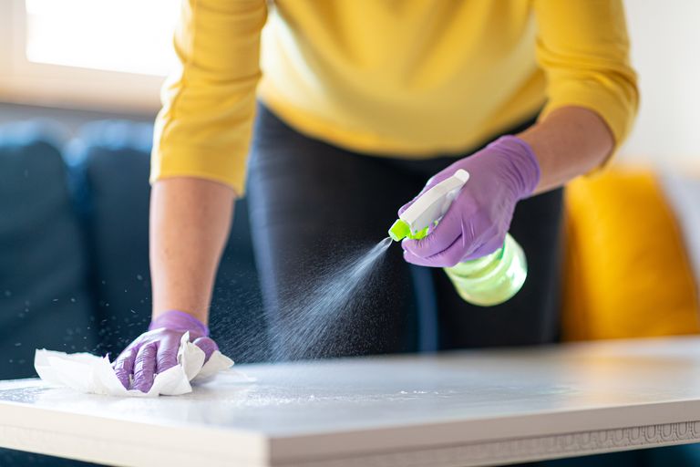 https://www.gettyimages.co.uk/detail/photo/hands-in-gloves-disinfecting-coffee-table-royalty-free-image/1216385006?phrase=+spray+furniture