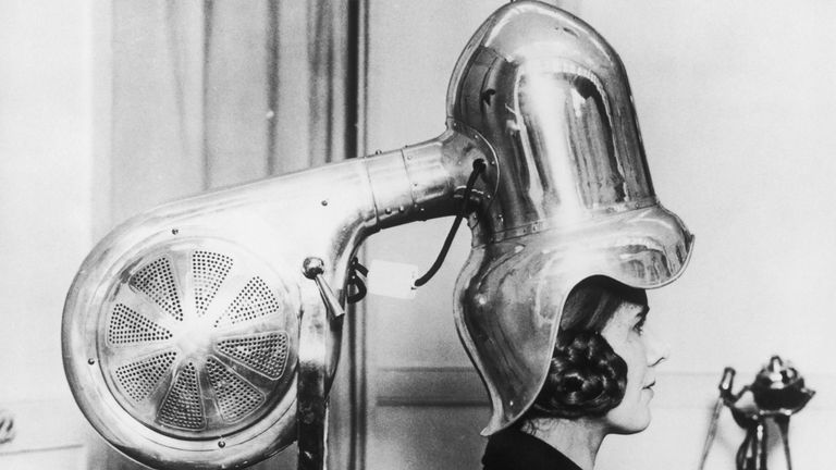 https://www.gettyimages.co.uk/detail/news-photo/woman-sitting-under-a-large-chrome-plated-hairdryer-1928-news-photo/51058441