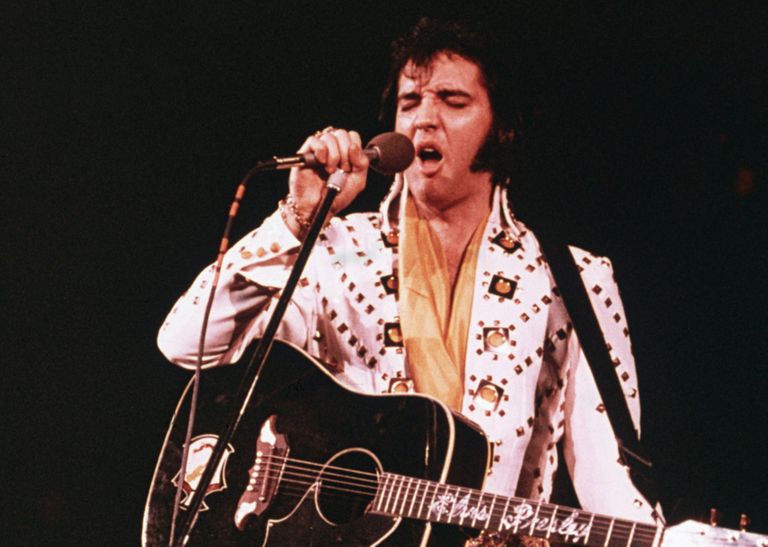 https://www.gettyimages.co.uk/detail/news-photo/american-rock-singer-elvis-presley-wearing-a-white-news-photo/3232254